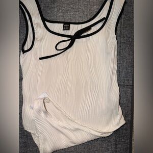White Sleeveless Top with Black Trim